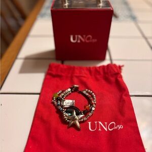 Genuine Uno de 50. Multi strand beaded with a star bracelet.